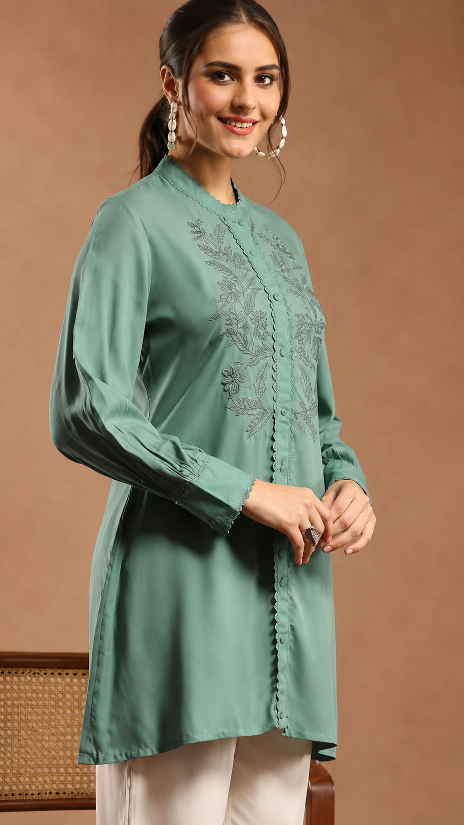Women Solid Embroidered A-line Viscose Rayon Tunic