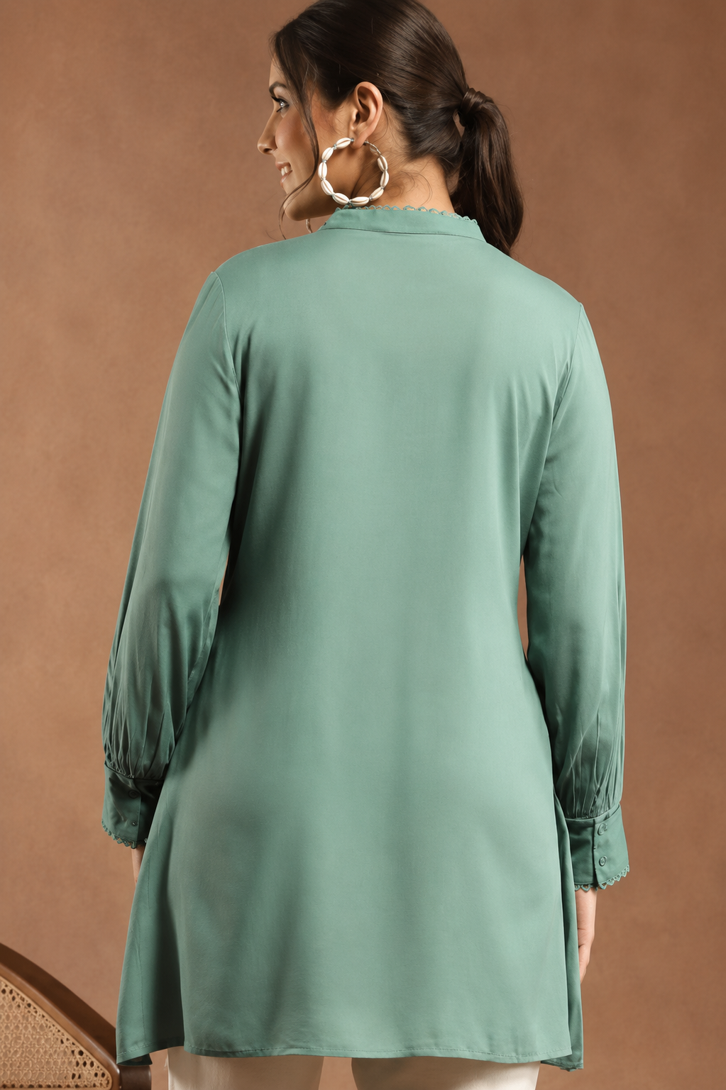Women Solid Embroidered A-line Viscose Rayon Tunic