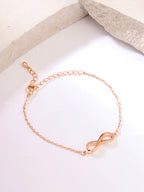 Women White Gold Toned Infinity Shape Crystal Studded Charming Bracelet